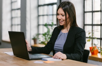 smiling woman attending workshop online